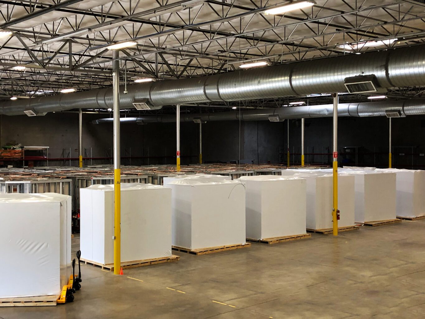 Equipment Covered on Pallets in Modular Factory