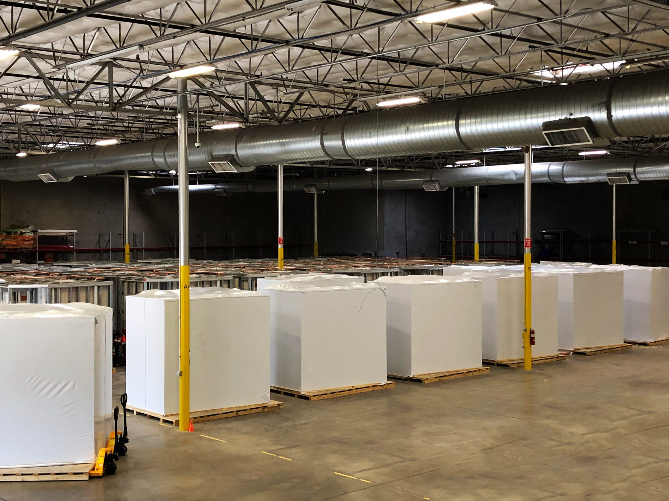 Equipment Covered on Pallets in Modular Factory