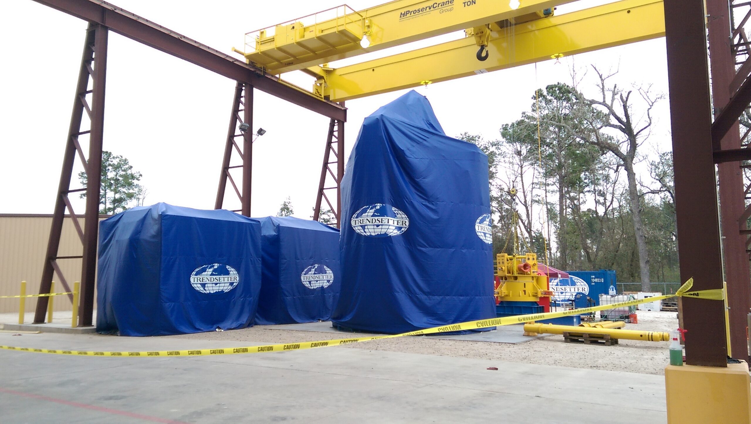 Construction Equipment Covered with Blue Cover