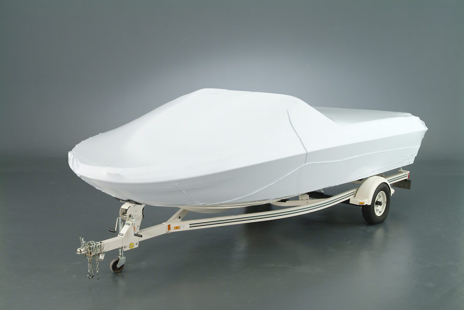 Boat Protected With a White Transhield Cover