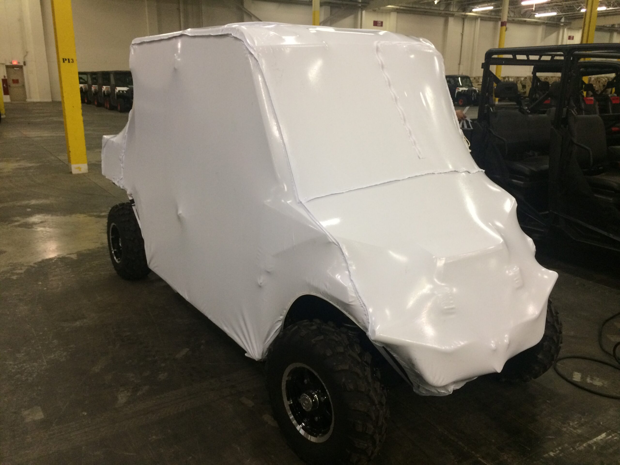 covered vehicle inside a factory
