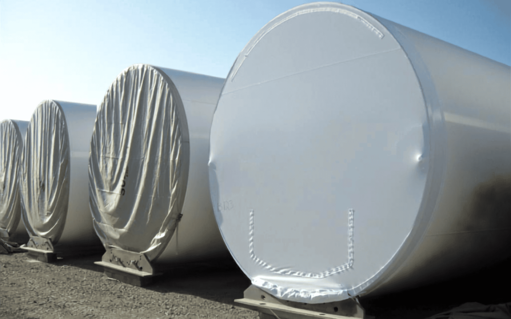 transhield shrinkable cover over cylindrical containers