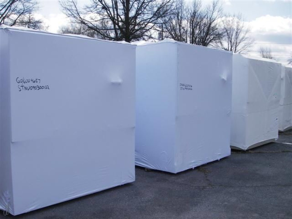 three pieces of equipment protected by a transhield custom cover
