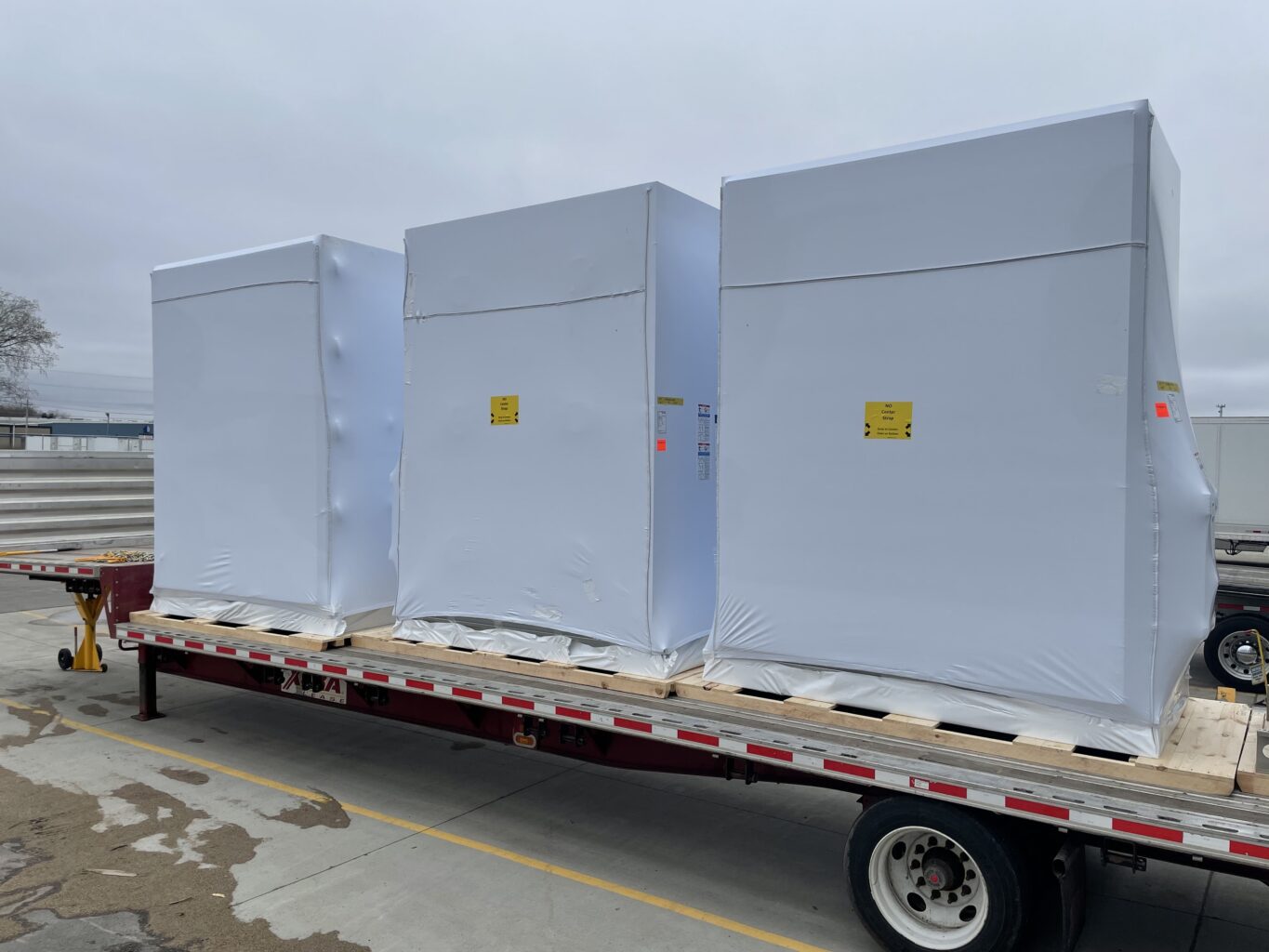3 electrical skids covered with a transhield cover ready for transport